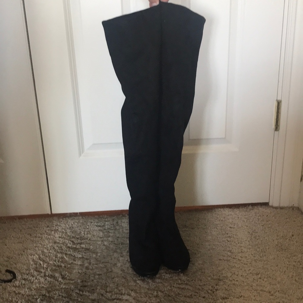 Knee high black heeled boots